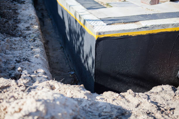 Professional Basement Waterproofing technician working in Derwood, MD